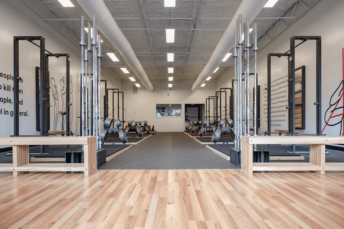Starting Strength gym interior showing symmetrical layout with multiple power racks